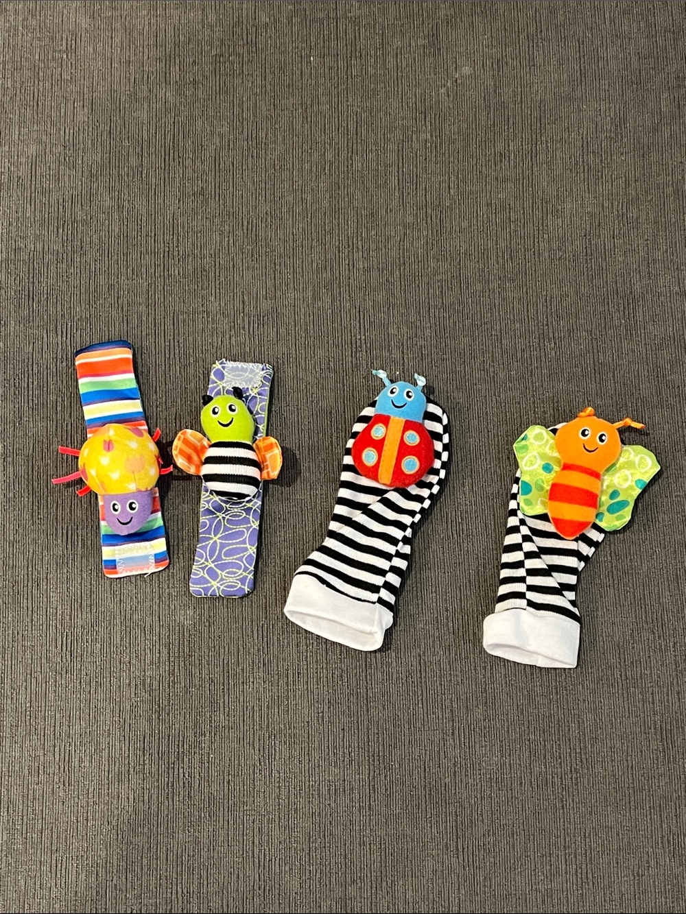 Like New Set of 4 Baby Wrist and Foot Rattles with Colorful Bug Designs